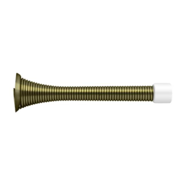 Deltana - 3-3/4'' Baseboard Door Bumper, HD, Steel - Antique Brass