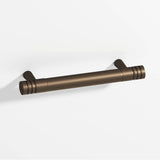 Colonial Bronze - 4'' center-to-center, 5'' overall, 0.46875'' diameter Round, grooved Cabinet Pull with tapered posts hand finished in Heritage Bronze and Heritage Bronze - Heritage Bronze,Heritage Bronze