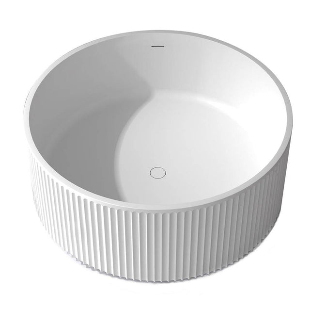 Lacava - Free-standing soaking bathtub with fluted detailing made of white solid surface with overflow and a decorative solid surface drain; net weight 364 lbs, water capacity 105 gal. Shipping class 5. DIAM: 51'', H: 21-5/8'' - Matte White Solid Surface