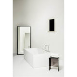 Freestanding bathtub, made of Sentec solid surface, with tap bank on left-hand side, with slotted overflow/front overflow, with lifting system