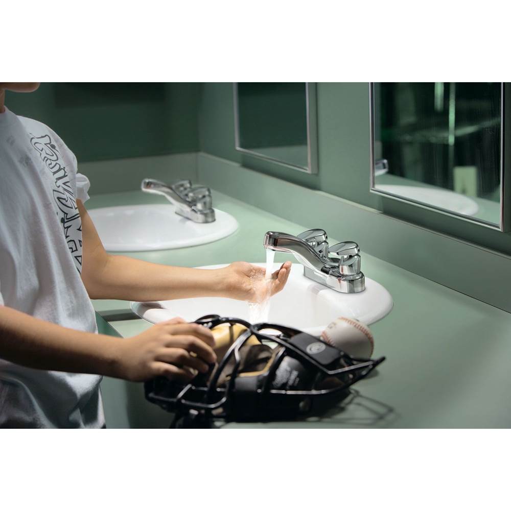 Chrome two-handle metering lavatory faucet