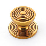 Schaub And Company - Knob with backplate, Paris Brass, 1-1/8'' dia - Paris Brass