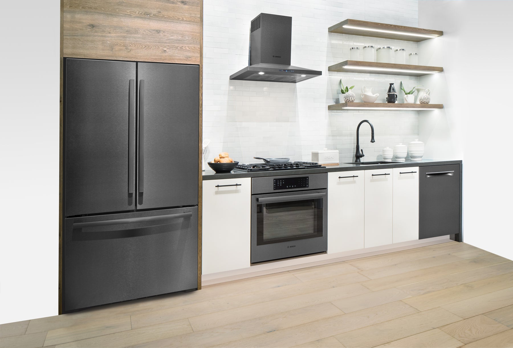 Bosch suite in a navy-and-oak kitchen
